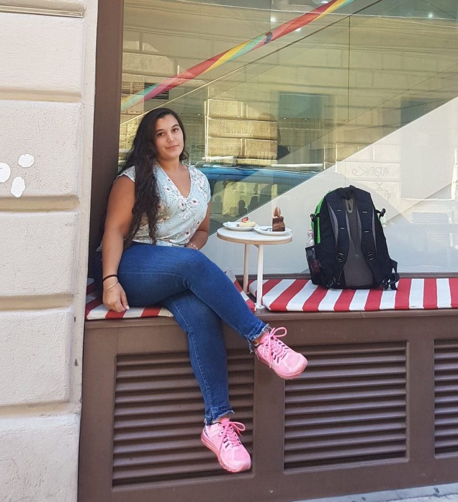 girl outside budapest cake shop